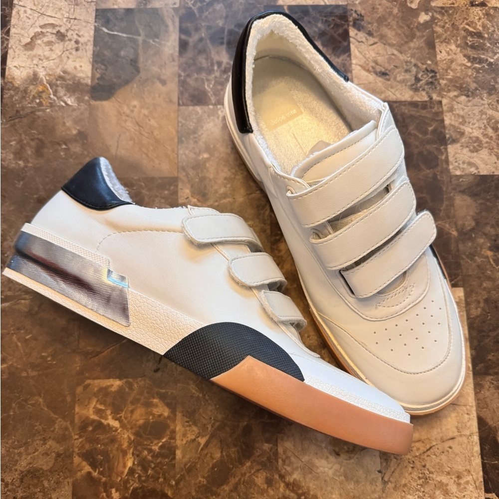 Comfy casual sneaker. Three Velcro strap closure. No box. Never worn